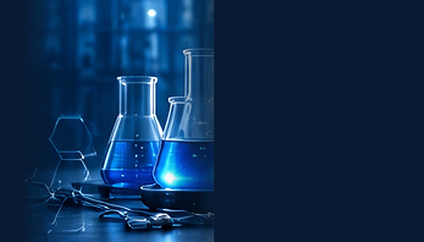 Laboratory glassware with blue chemical solutions