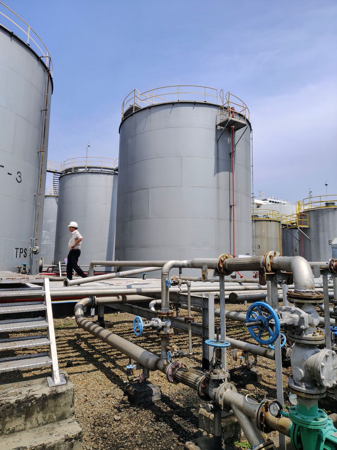 Storage tanks and valve piping at a fuel terminal
