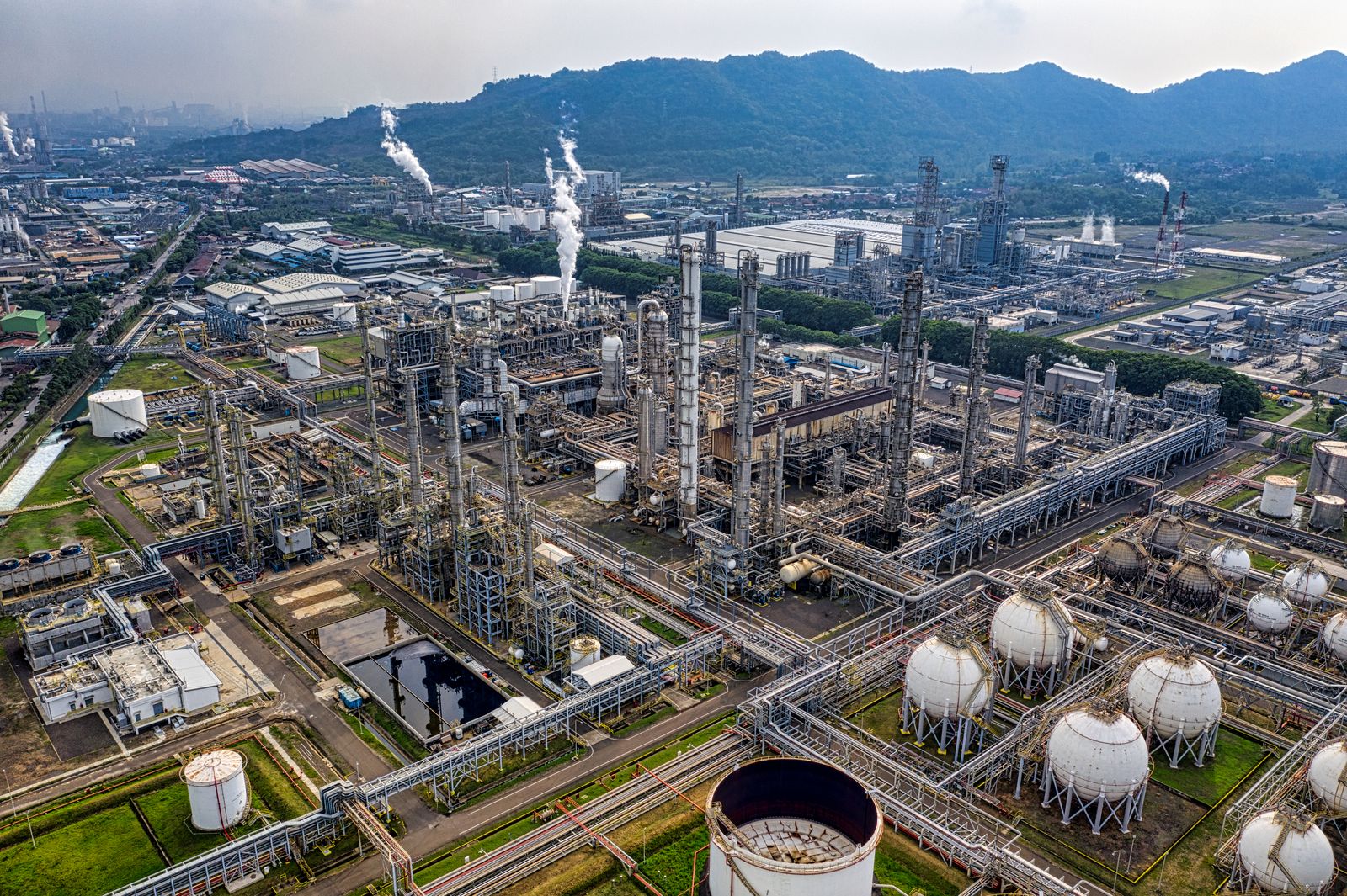 Aerial view of an industrial refinery complex in operation